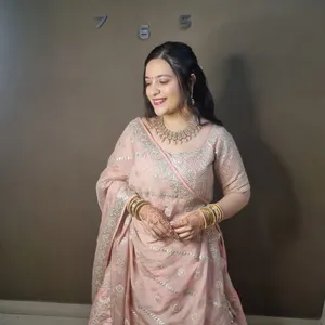 Party makeup in pink lehenga with mehendi hands, Megha Makeover & Beauty Salon