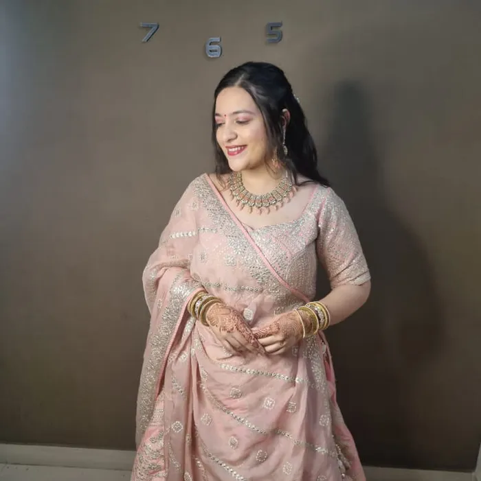 Party makeup in pink lehenga with mehendi hands, Megha Makeover & Beauty Salon