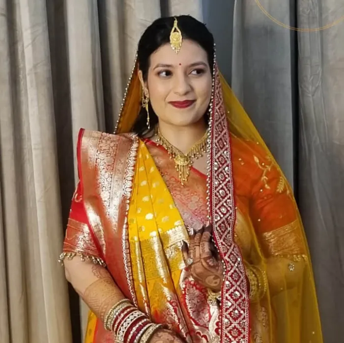 Bridal makeover in yellow and red Banarasi saree, Megha Makeover & Beauty Salon, Ahmedabad